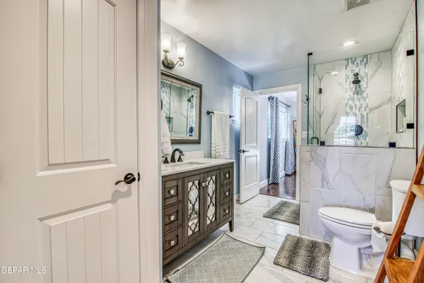 a view of a patio with a table chairs and a backyard