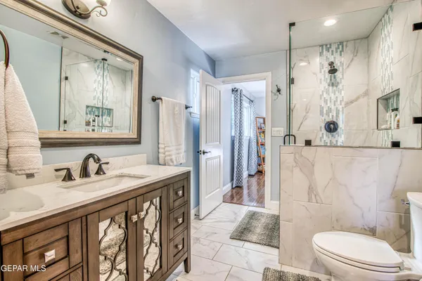 a dining room with furniture and wooden floor