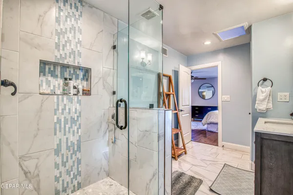 a view of the patio with couches and table and chairs and potted plants