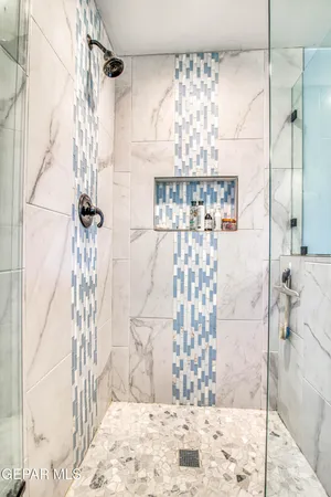 a view of a patio with couches table and chairs and potted plants