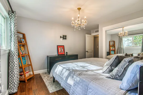 a view of swimming pool with outdoor seating and city view