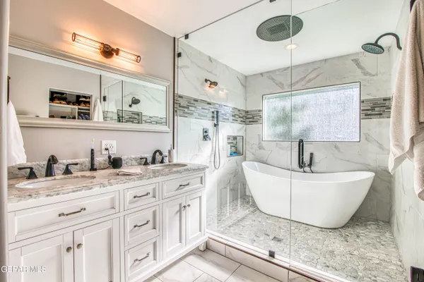 a view of a swimming pool with an outdoor space and seating area