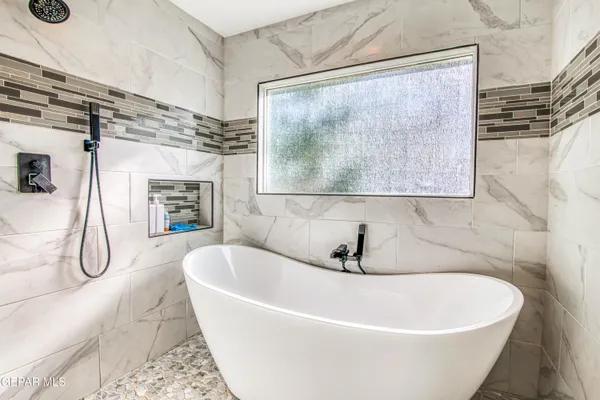 an aerial view of residential houses with outdoor space and river