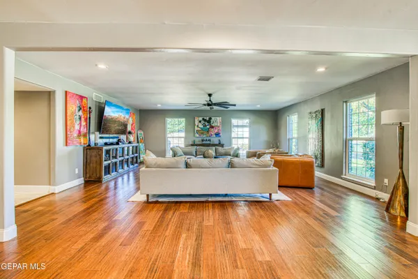 a living room with fireplace furniture and a flat screen tv