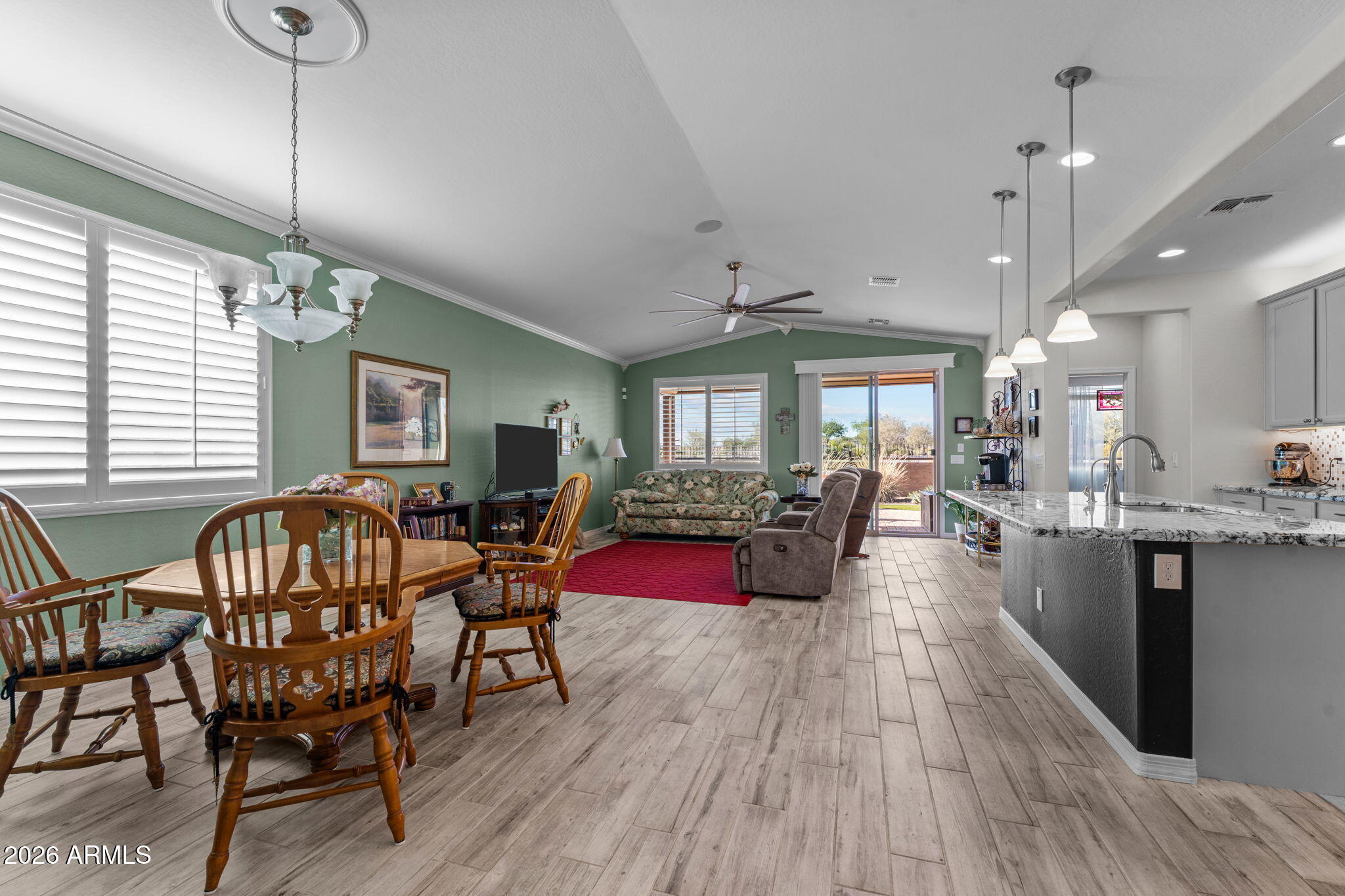 4320 Buffalo Ridge Wickenburg, AZ 85390 - Photo 13 of 57 a view of a dining room with furniture window and wooden floor