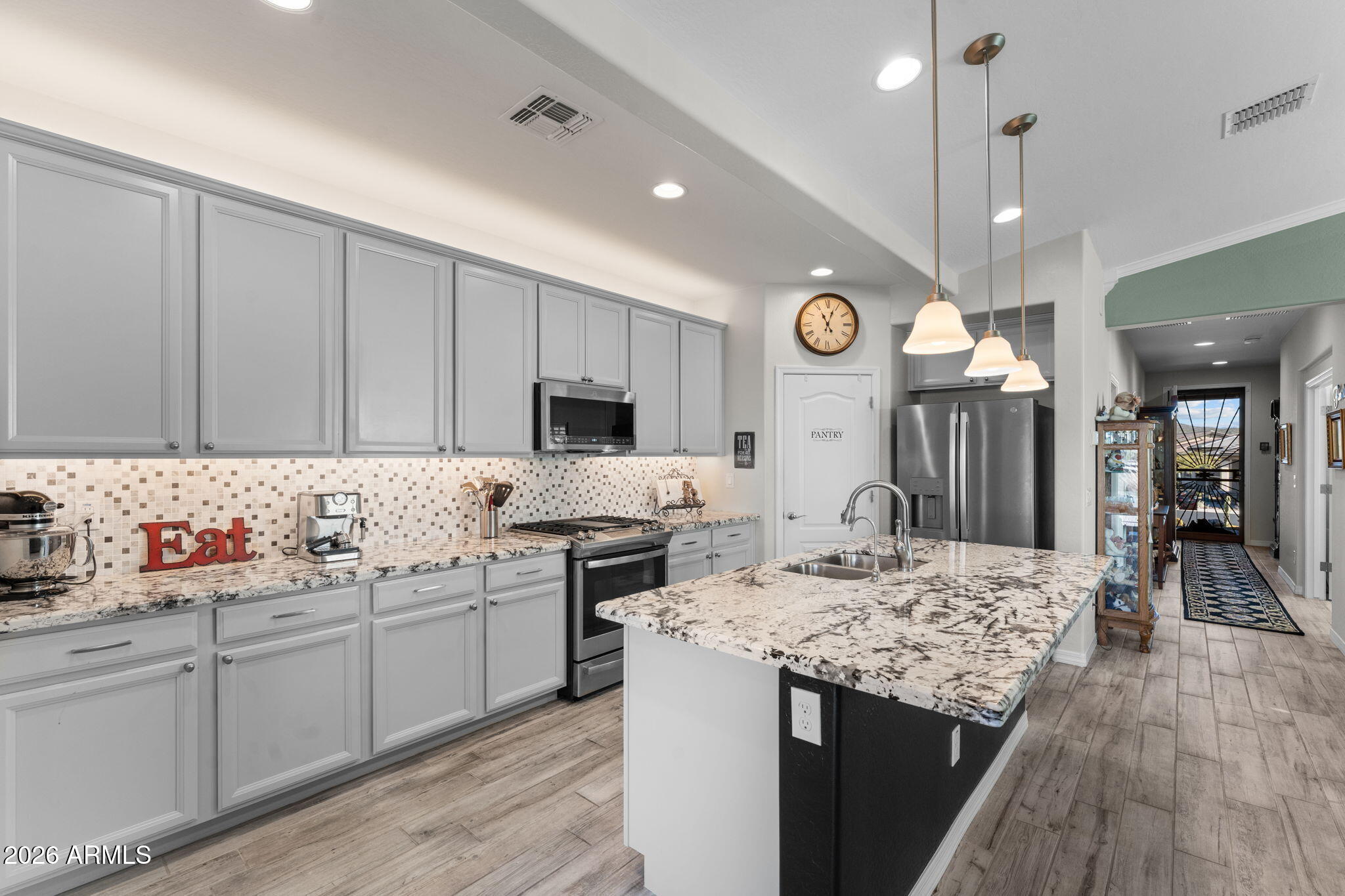 4320 Buffalo Ridge Wickenburg, AZ 85390 - Photo 2 of 57 a kitchen with stainless steel appliances kitchen island granite countertop a sink and cabinets