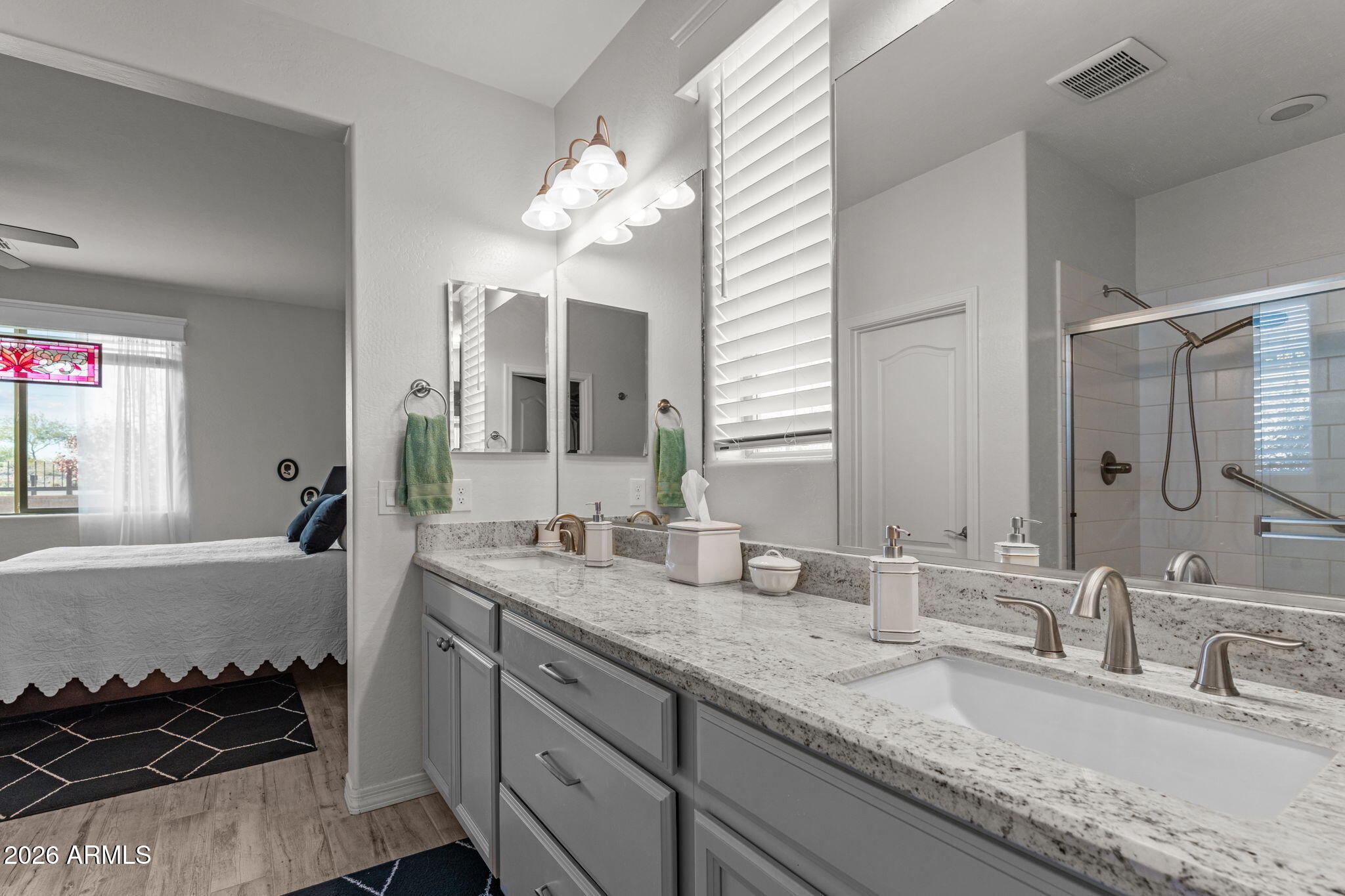 4320 Buffalo Ridge Wickenburg, AZ 85390 - Photo 25 of 57 a bathroom with a granite countertop sink and a mirror