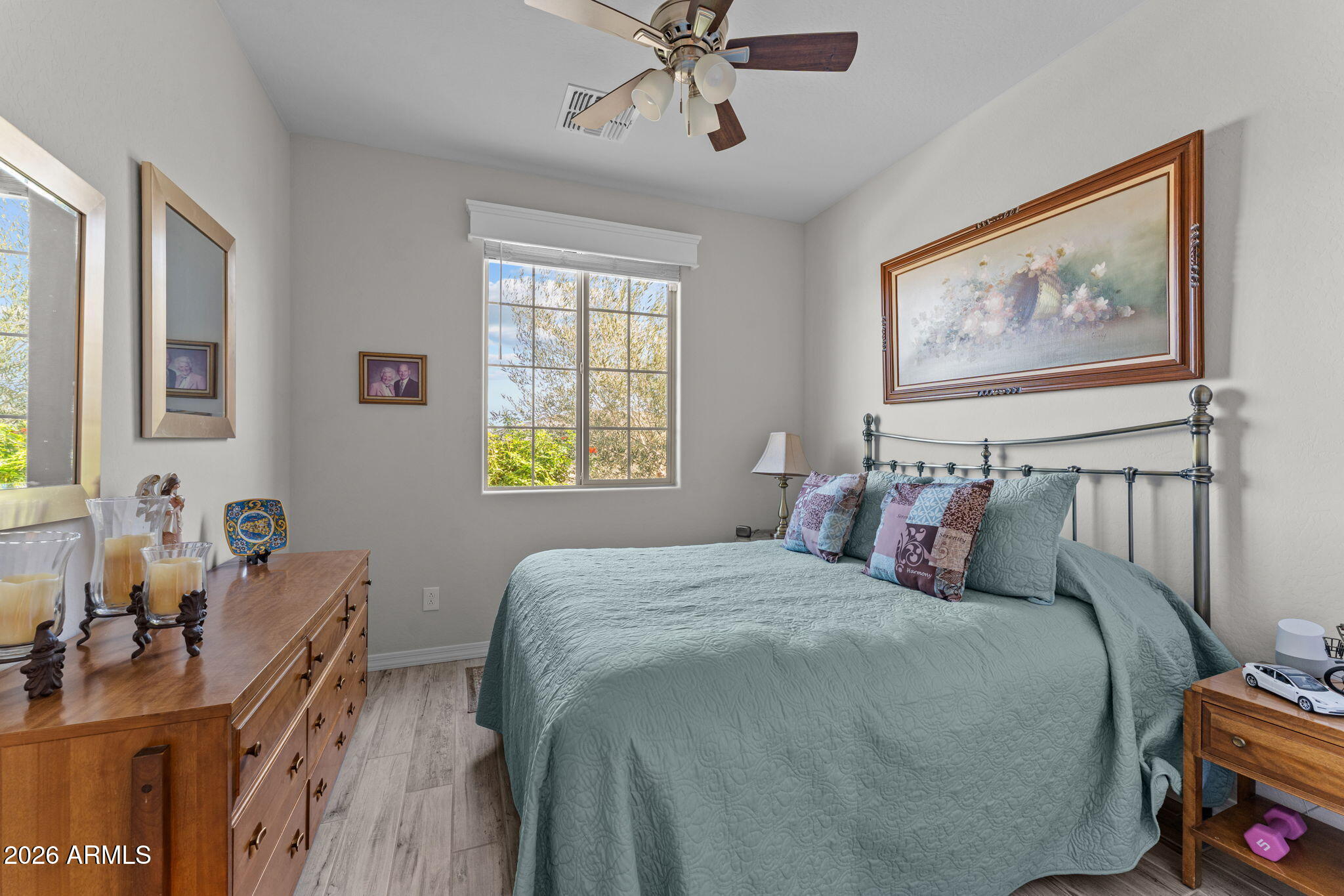 4320 Buffalo Ridge Wickenburg, AZ 85390 - Photo 26 of 57 a bedroom with a bed and a chandelier