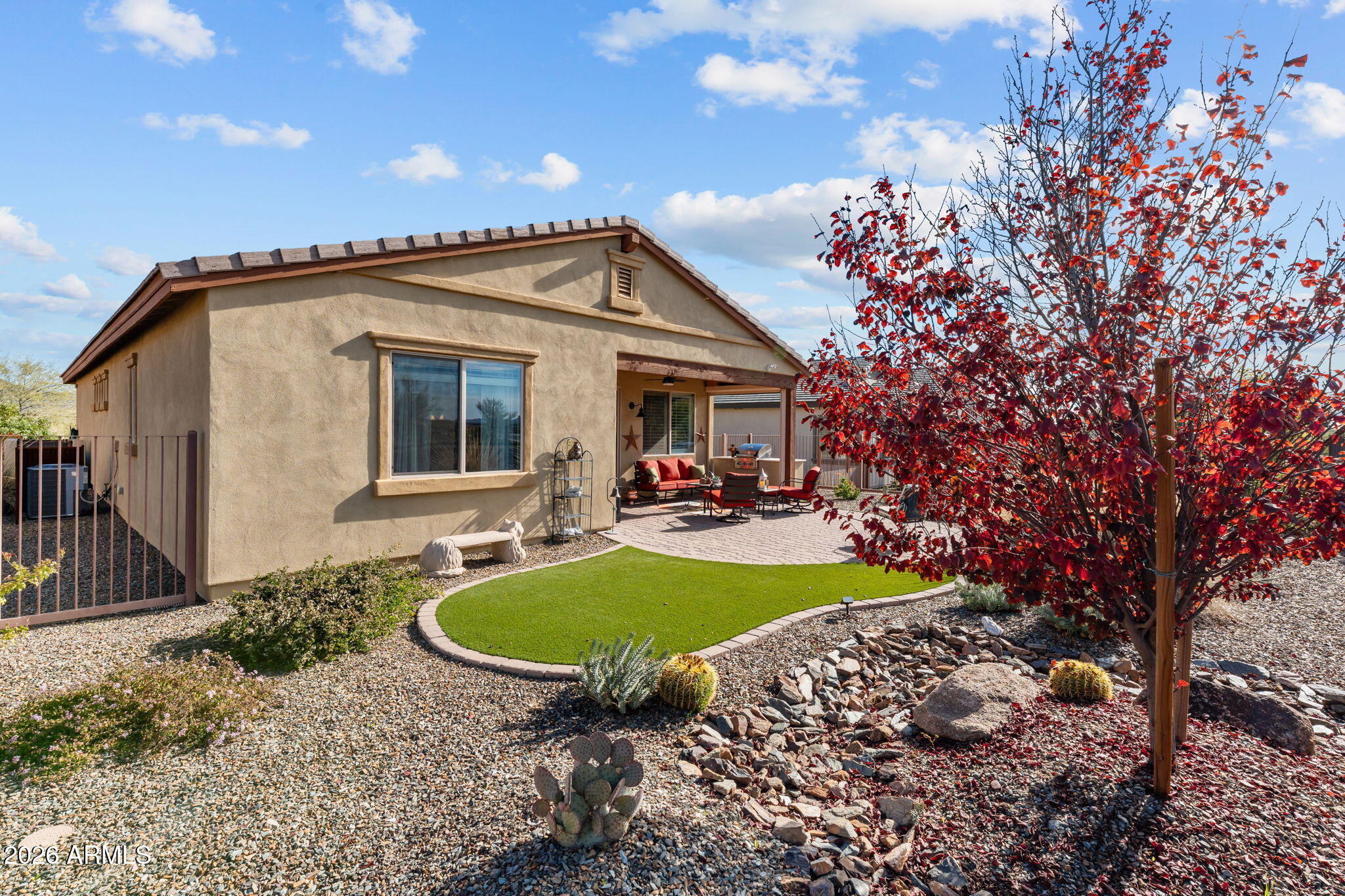 4320 Buffalo Ridge Wickenburg, AZ 85390 - Photo 32 of 57 a view of a house with backyard and sitting area