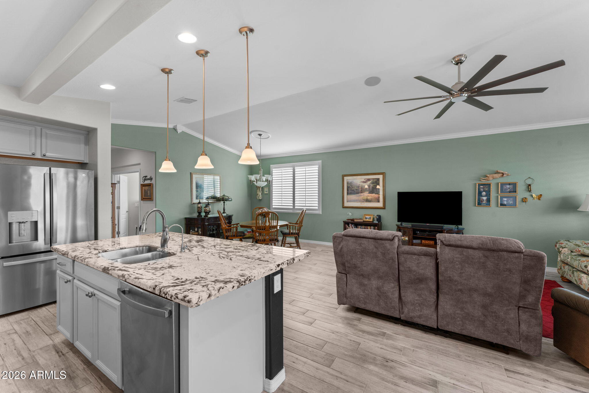 4320 Buffalo Ridge Wickenburg, AZ 85390 - Photo 9 of 57 a view of a kitchen counter top space a sink appliances and a ceiling fan