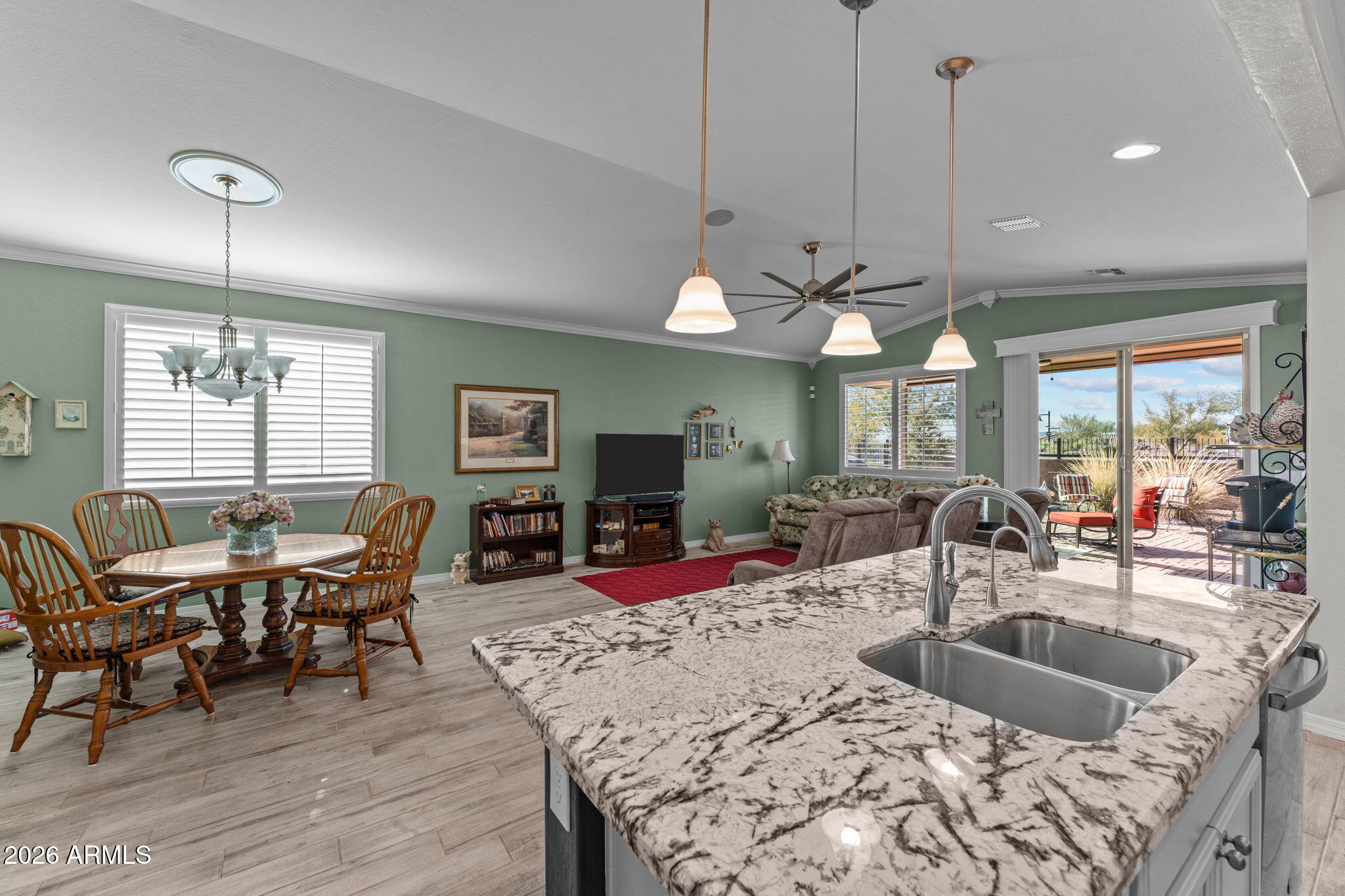 4320 Buffalo Ridge Wickenburg, AZ 85390 - Photo 10 of 57 a view of a dining room with furniture window and wooden floor
