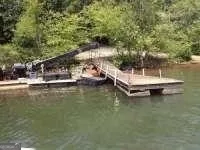 a view of a lake with boats and trees