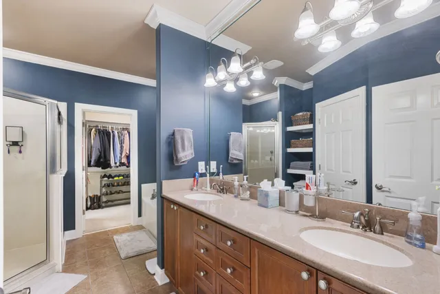 a bathroom with a shower and a sink