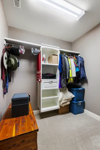 a view of a patio with table and chairs under an umbrella
