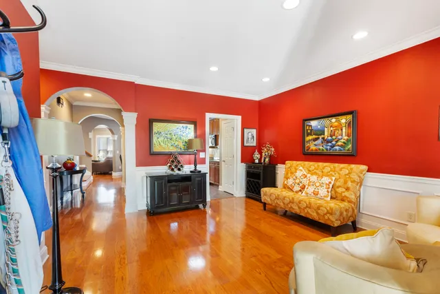 a living room with furniture and large windows