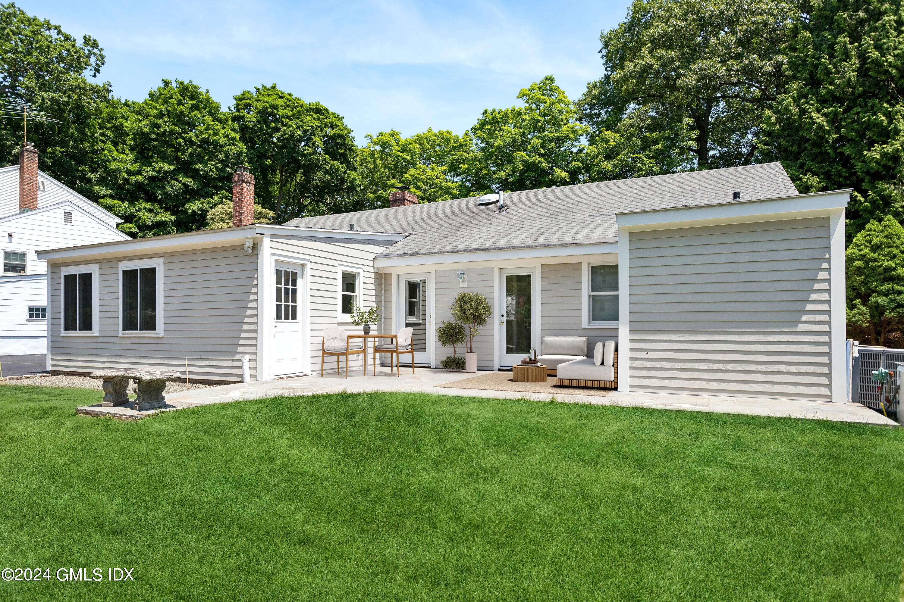 12 Wescott Street Riverside, CT 06878 - Photo 11 of 12 a front view of house with a garden and patio
