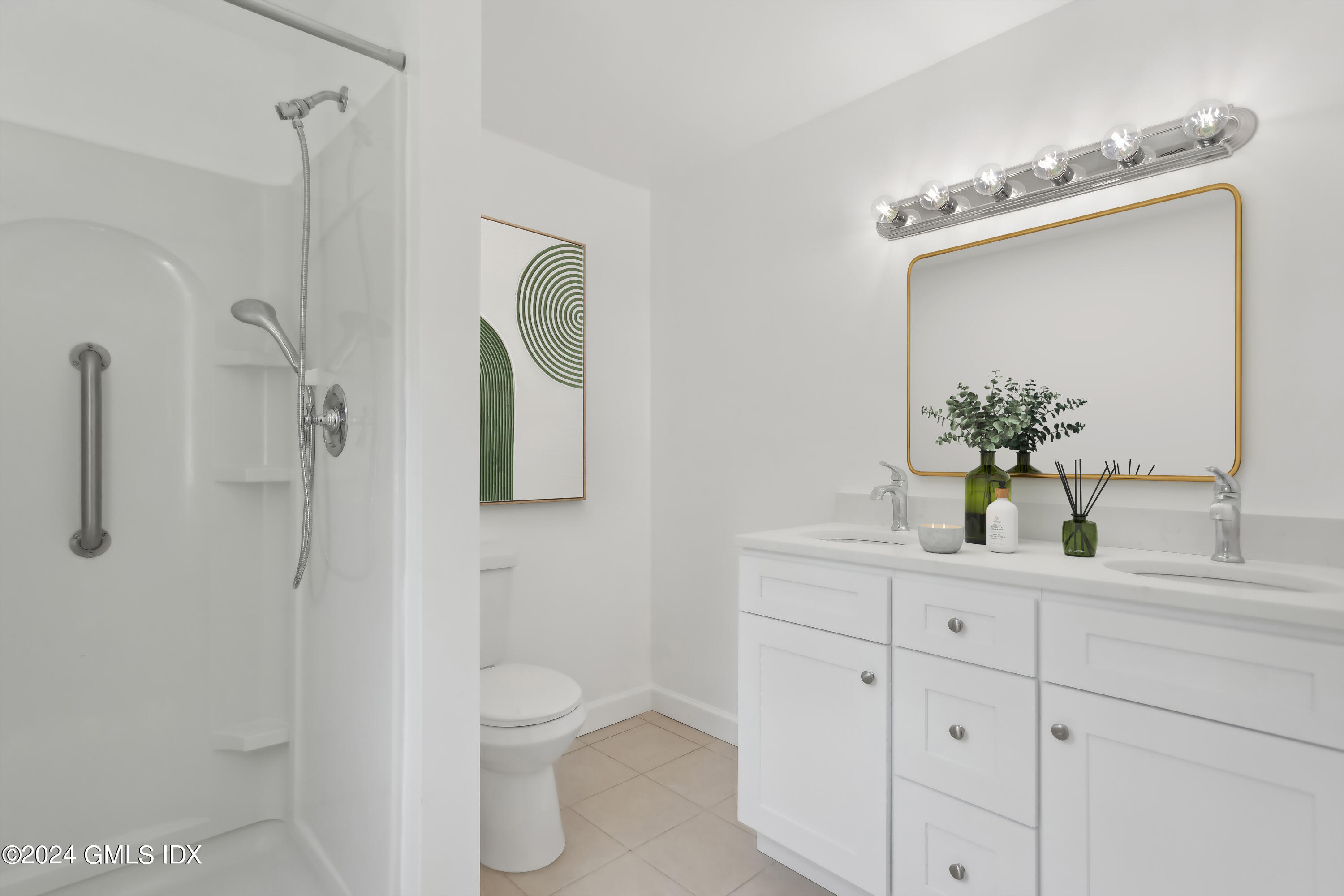 12 Wescott Street Riverside, CT 06878 - Photo 7 of 12 a bathroom with a granite countertop sink a toilet and a mirror