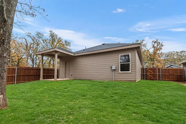 a backyard of a house with lots of green space