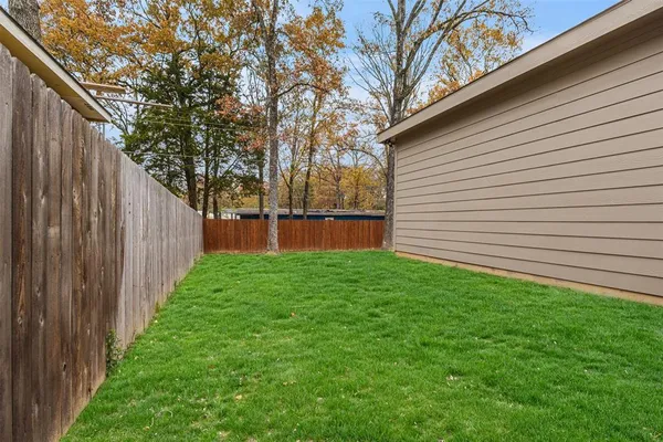 a backyard of a house with lots of green space