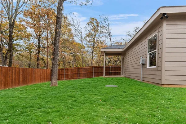 a backyard of a house with lots of green space