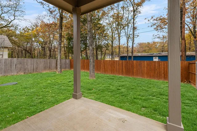 a backyard of a house with lots of green space