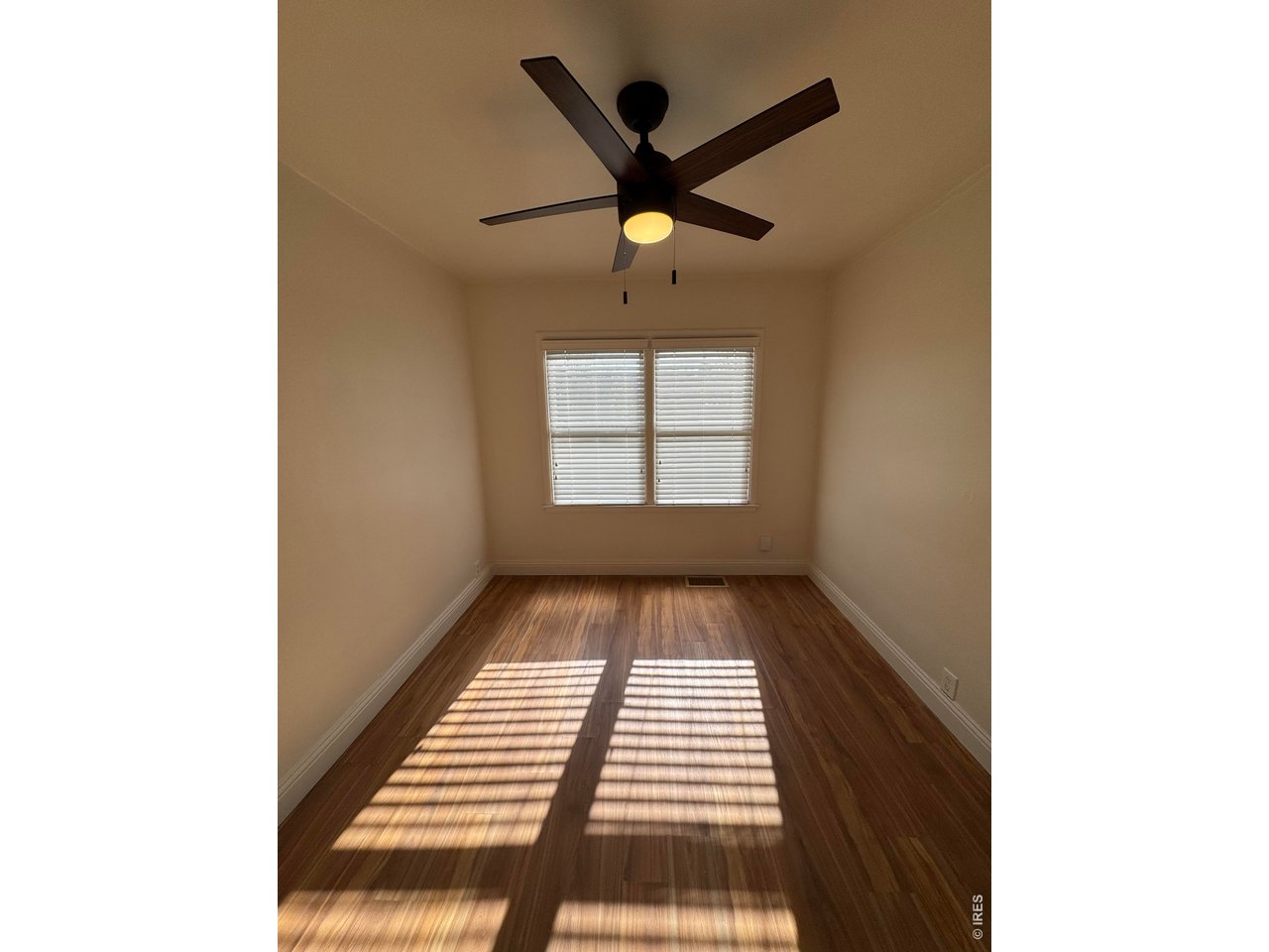 612 South Howes Street Fort Collins, CO 80521 - Photo 8 of 18 a view of an empty room with a window