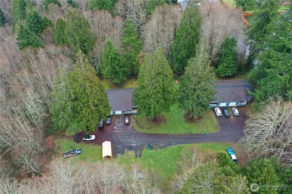 an aerial view of a house with a yard
