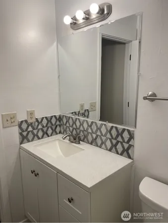 a bathroom with a sink and a toilet