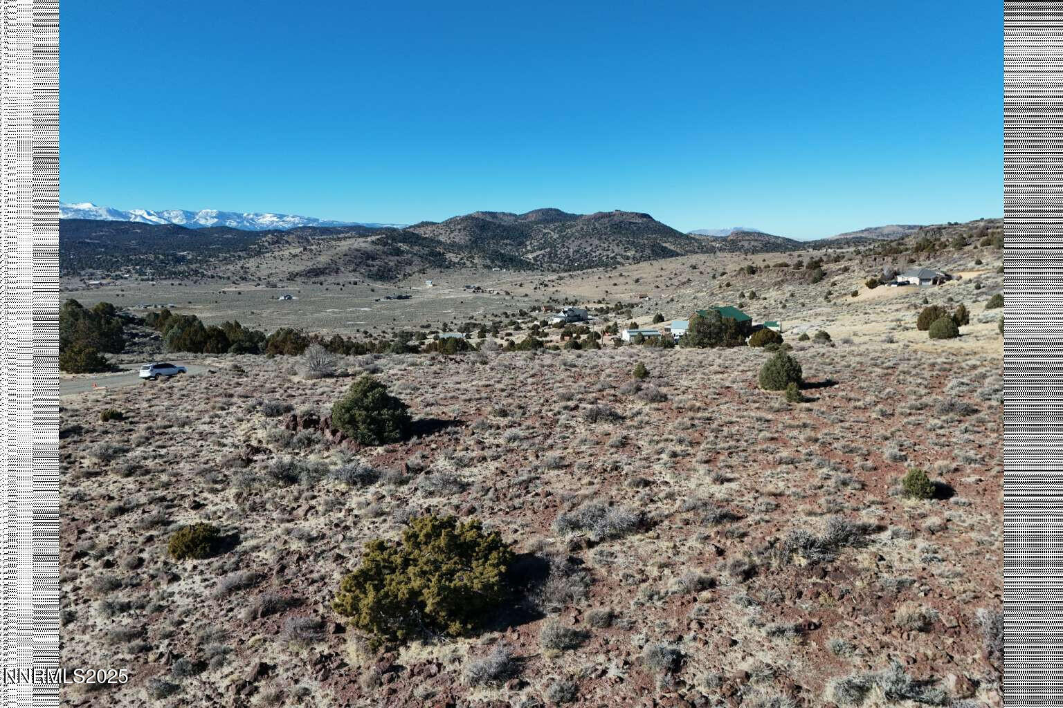 3180 Cartwright Road Reno, NV 89521 - Photo 10 of 19 a view of a dry field with mountains in the background