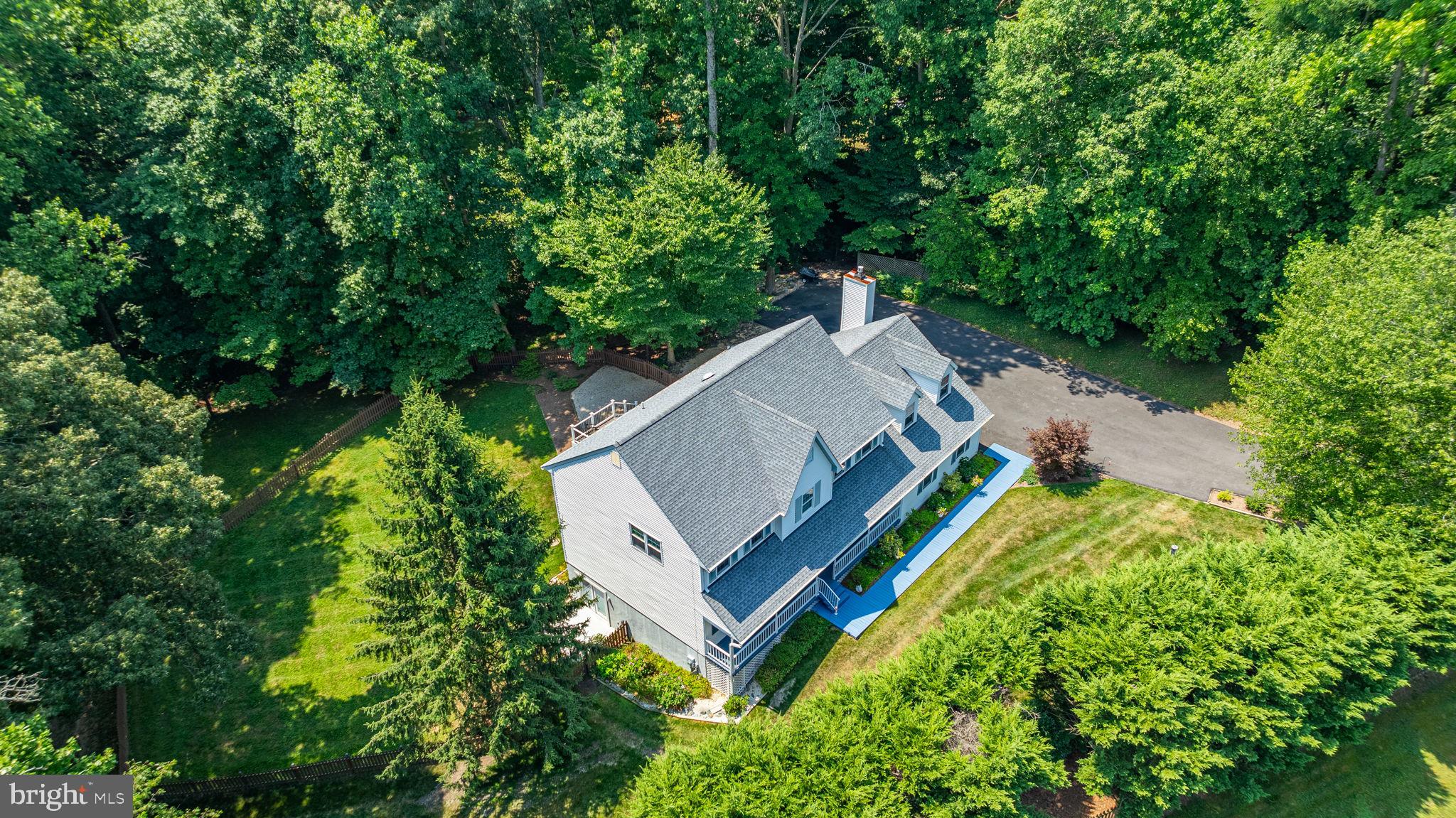 9741 Howes Road Dunkirk, MD 20754 - Photo 38 of 48 a view of a house with a yard and large trees