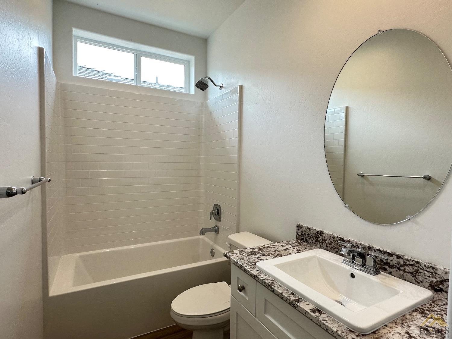 Undisclosed Address Bakersfield, CA 93311 - Photo 10 of 13 a bathroom with a sink toilet and shower