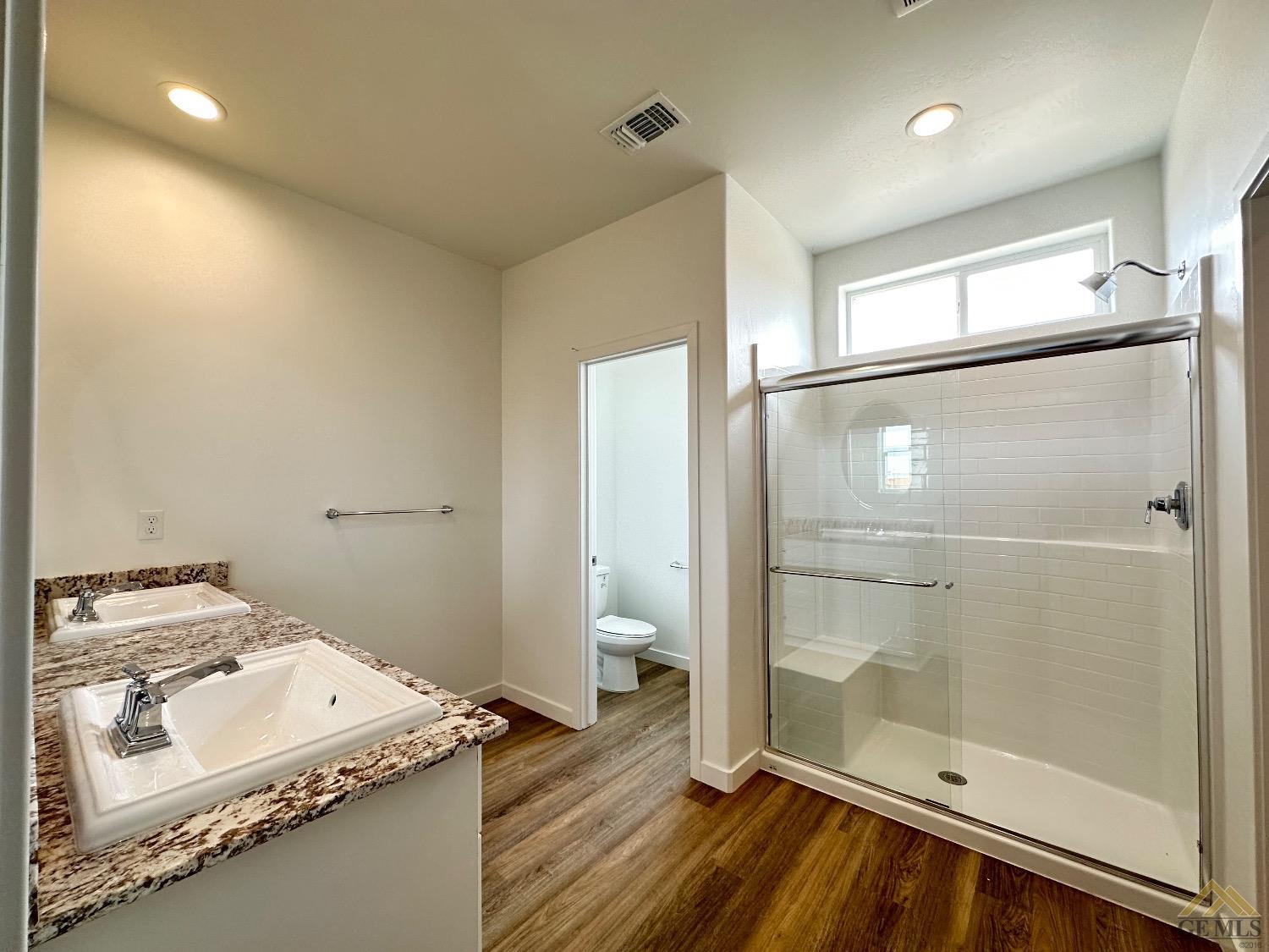 Undisclosed Address Bakersfield, CA 93311 - Photo 8 of 13 a bathroom with a sink and a mirror