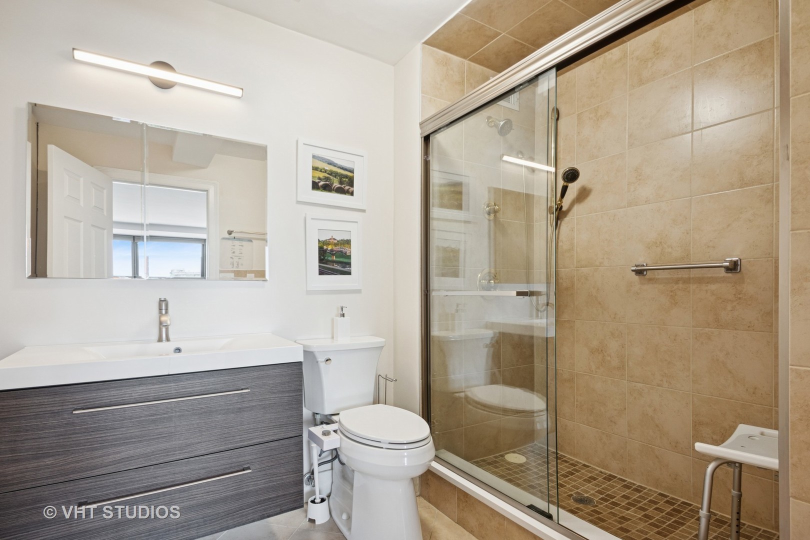 3150 North Sheridan Road, Unit 5A Chicago, IL 60657 - Photo 21 of 34 a bathroom with a sink a toilet and shower