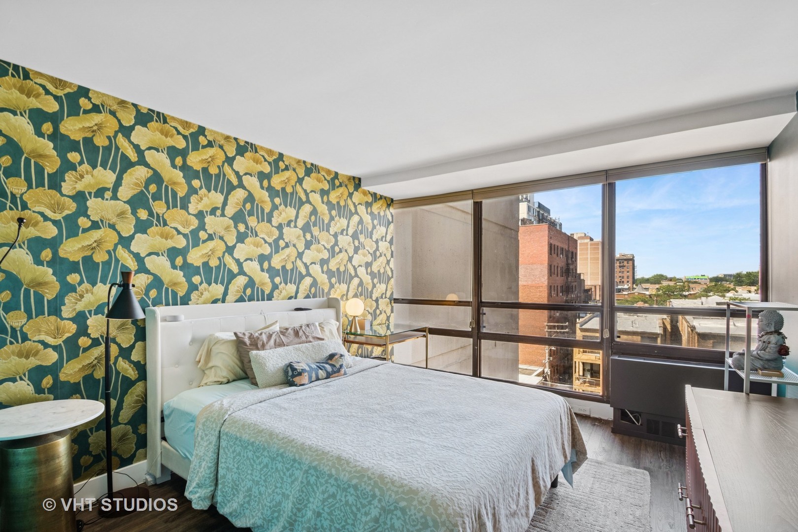3150 North Sheridan Road, Unit 5A Chicago, IL 60657 - Photo 24 of 34 a bedroom with a large bed and a balcony view
