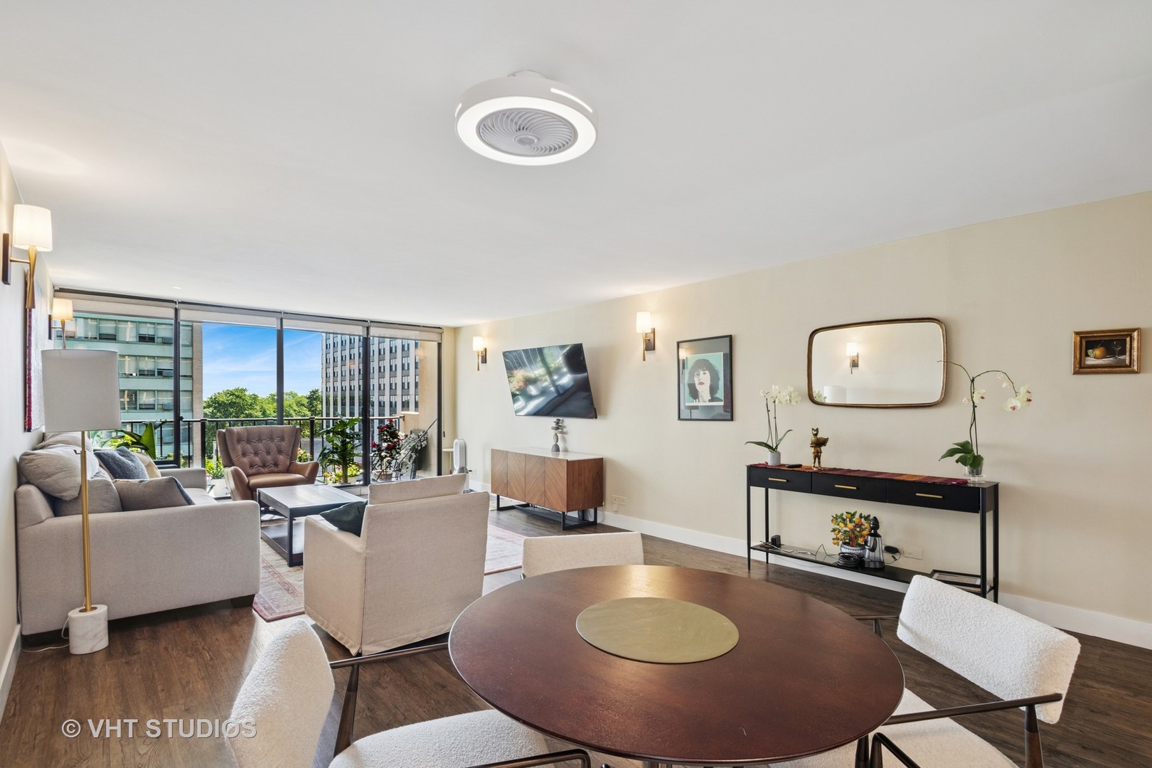 3150 North Sheridan Road, Unit 5A Chicago, IL 60657 - Photo 6 of 34 a living room with furniture a large window and a table