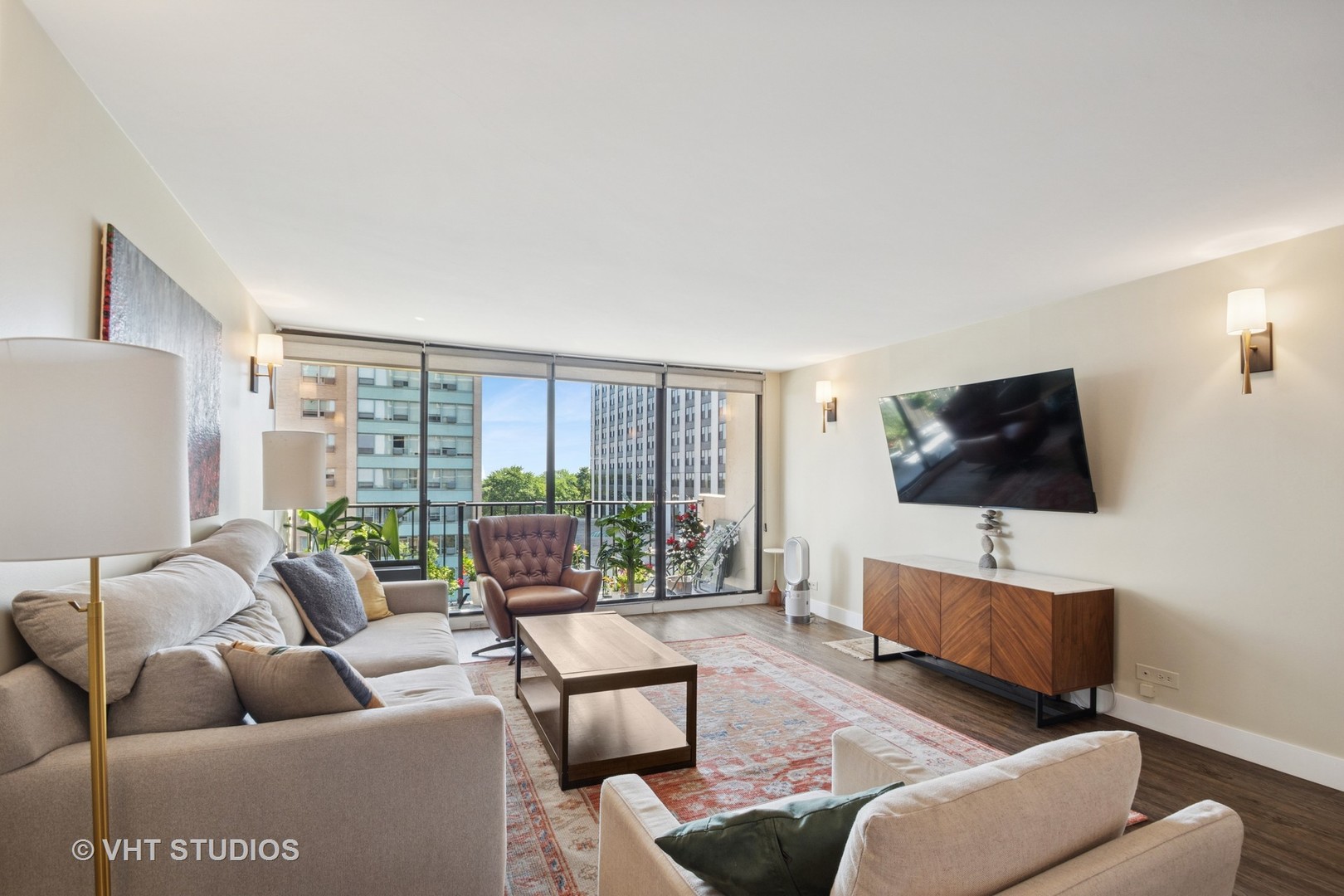 3150 North Sheridan Road, Unit 5A Chicago, IL 60657 - Photo 7 of 34 a living room with furniture and a flat screen tv