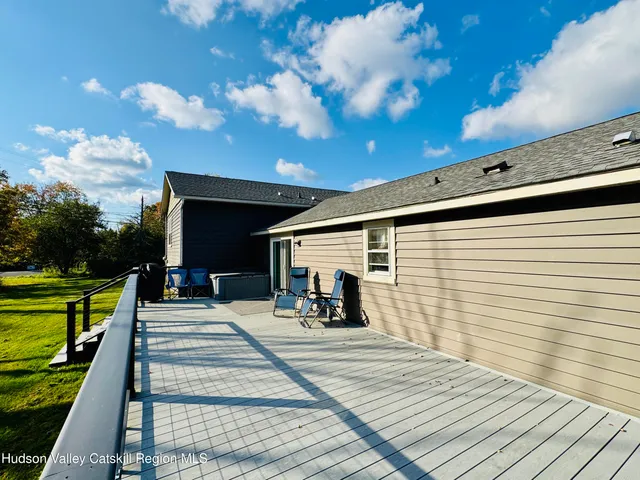 a view of a swimming pool with an outdoor space and seating area