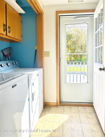 a utility room with closet dryer and washer