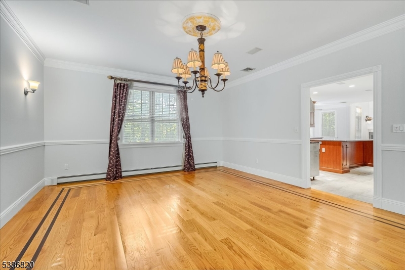 47 Stonehedge Drive Stockholm, NJ 07460 - Photo 14 of 36 a view of a room with wooden floor and ceiling fan