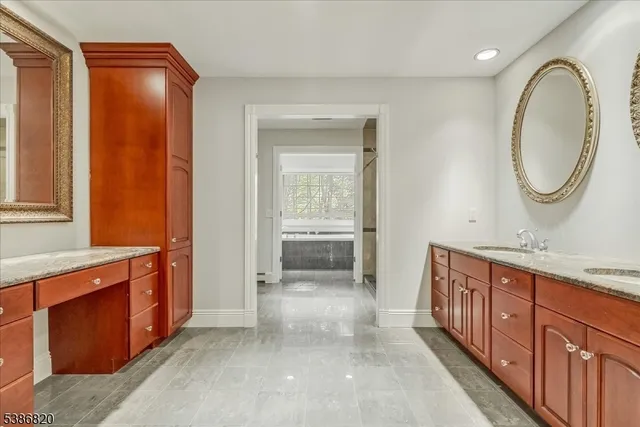 a bathroom with a double vanity sink and a mirror