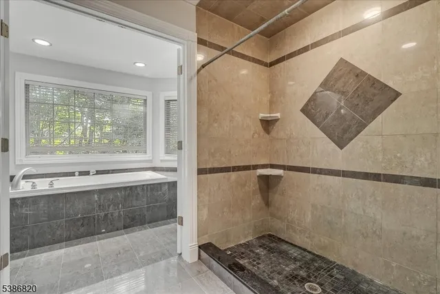 a bathroom with a shower and a sink