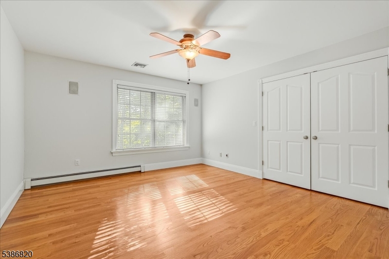 47 Stonehedge Drive Stockholm, NJ 07460 - Photo 23 of 36 wooden floor in an empty room with a window