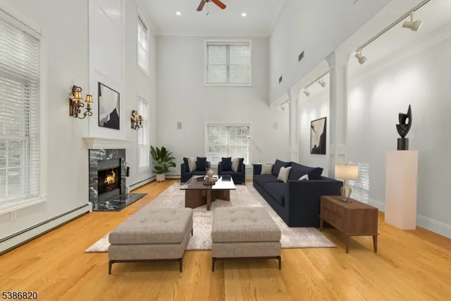 a living room with furniture and a fireplace