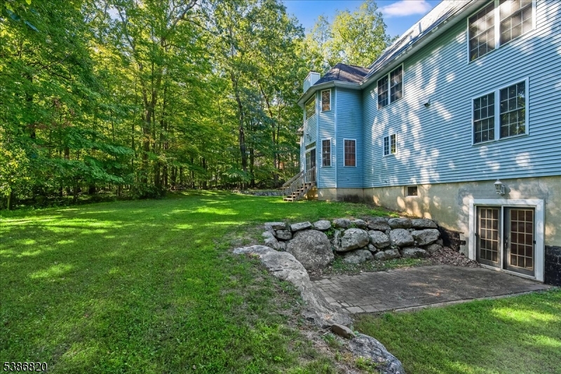 47 Stonehedge Drive Stockholm, NJ 07460 - Photo 31 of 36 a view of a house with backyard sitting area and garden