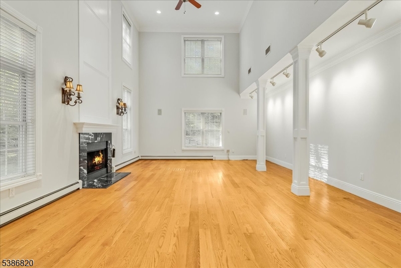 47 Stonehedge Drive Stockholm, NJ 07460 - Photo 4 of 36 a view of empty room with fireplace and windows