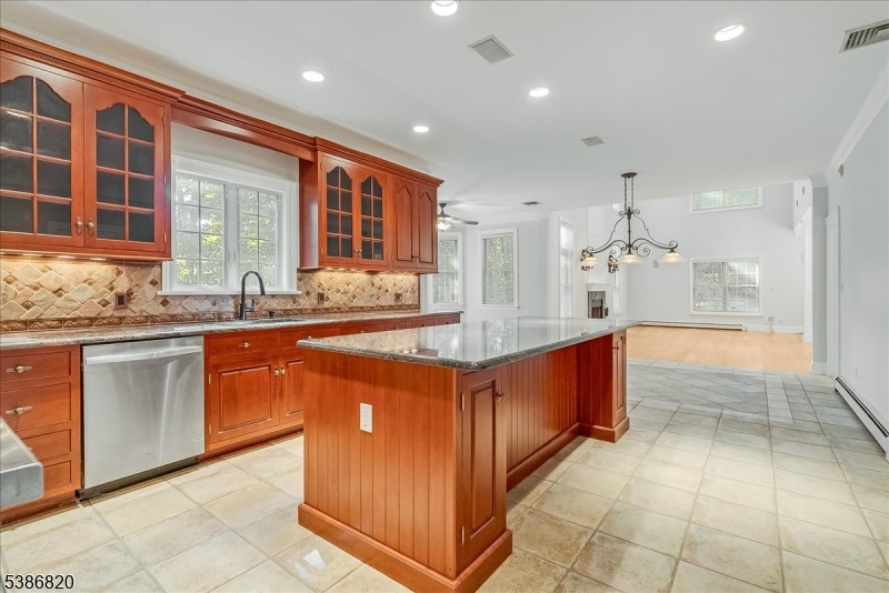 47 Stonehedge Drive Stockholm, NJ 07460 - Photo 6 of 36 a large kitchen with kitchen island granite countertop a large counter top and stainless steel appliances