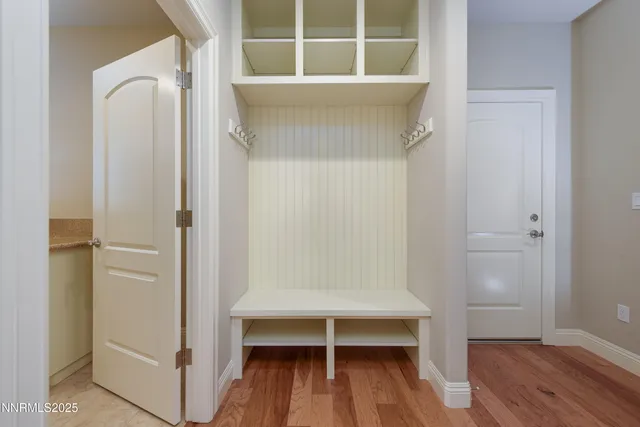 a bathroom with a granite countertop sink mirror and shower