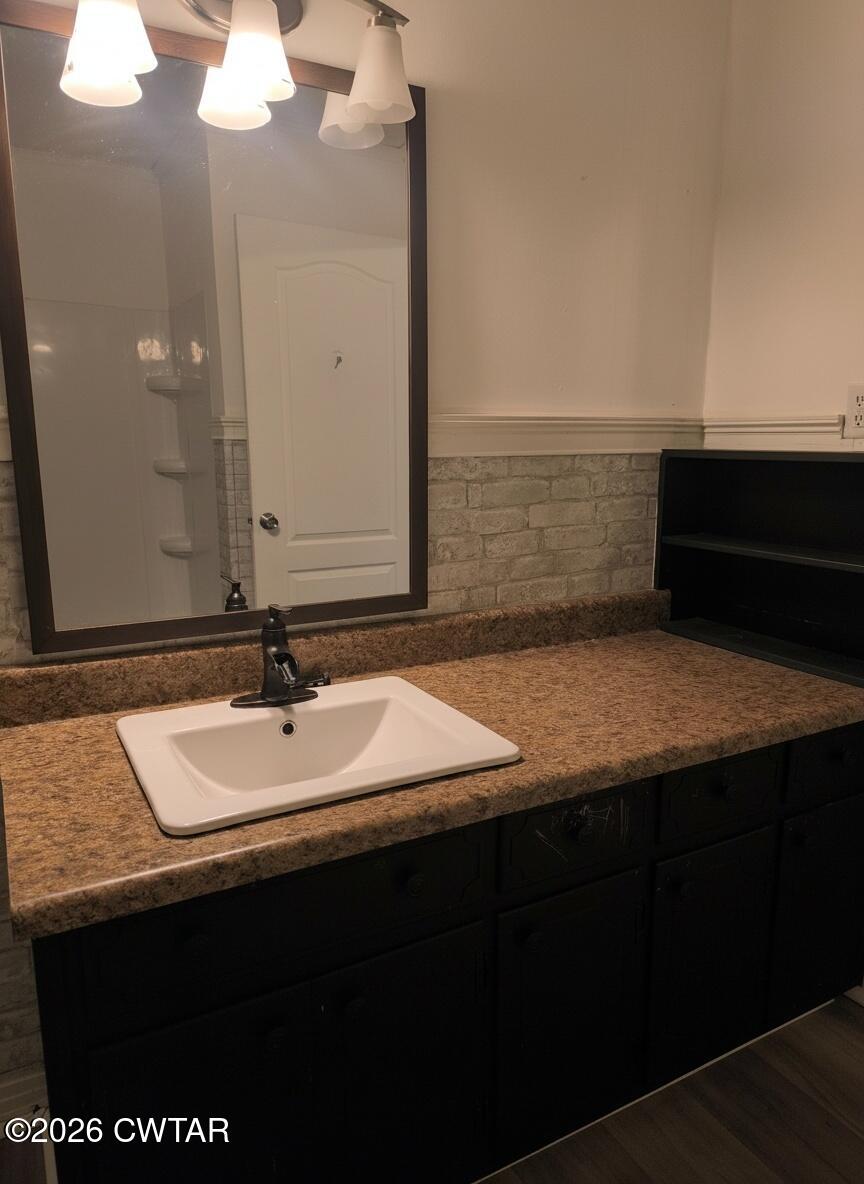 513 Viar Road Dyersburg, TN 38024 - Photo 19 of 37 a bathroom with a sink and a mirror