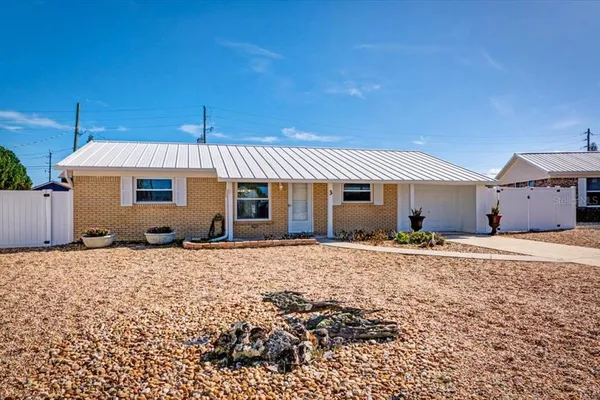 a front view of a house with a patio