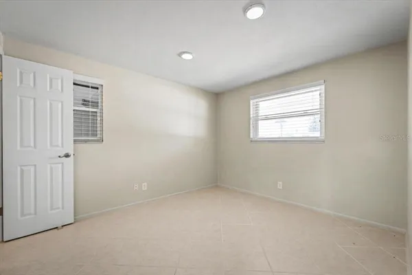an empty room with closet area